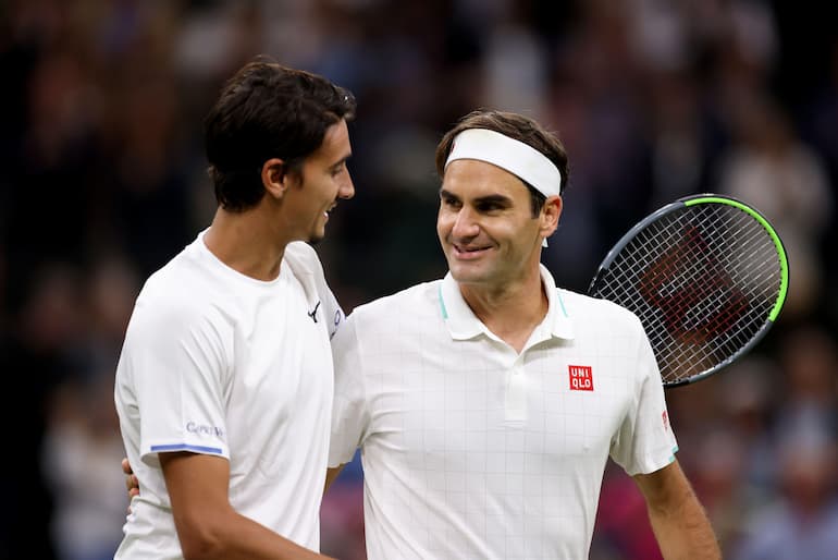 Sonego con Federer